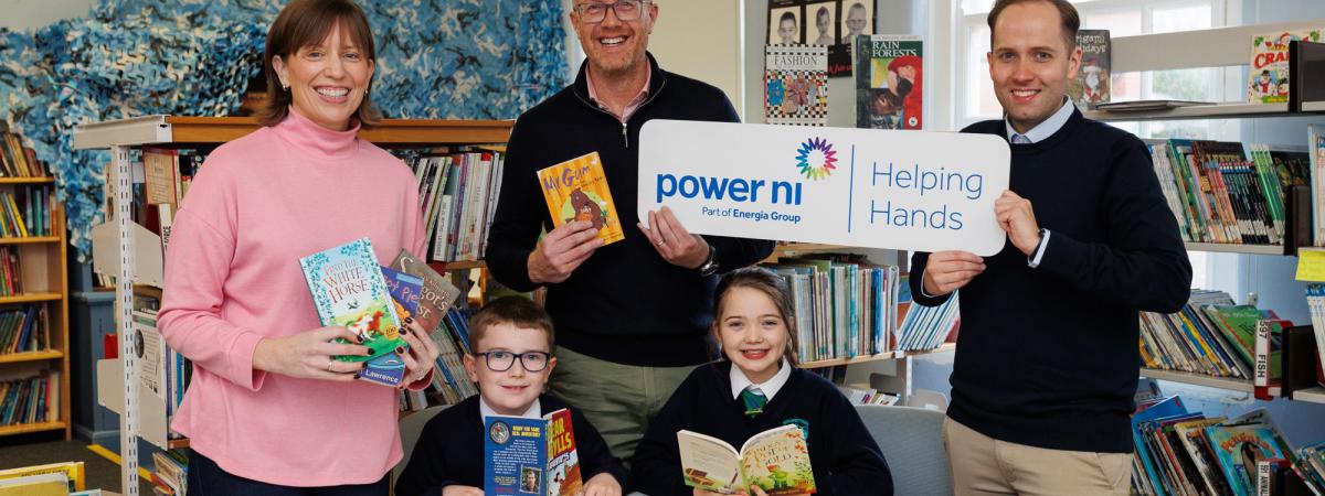 Pictured (L-R) is Gwyneth Compston of Power NI, Colin Devine and Max Burns of Strandtown Primary, and pupils of Strandtown Primary School.