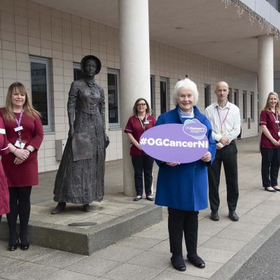 Louise Collins (OG Clinical Nurse Specialist, Belfast Trust), Ciara Toal (Assistant Service Manager, Cancer Services), Maureen Toner (OG Clinical Nurse Specialist, Belfast Trust), Helen Setterfield (chair, OG Cancer NI), Ray Kennedy (surgeon, Belfast Trust), Karen Graham (OG Clinical Nurse Specialist, Belfast Trust) and Nicole Patton (CNS Support Worker, Belfast Trust) outside the Cancer Centre at the Belfast City Hospital ahead of the launch of the OG Cancer 2021 Catch It Early campaign.