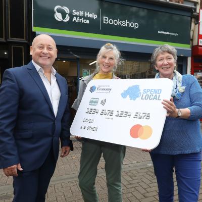 Denny Elliott, Head of Self Help Africa Northern Ireland, is pictured with Self Help Africa Northern Ireland volunteers Jane Thompson and Maggie Crawford who are excited to welcome the Spend Local pre-paid cards in the Botanic Avenue store. https://selfhelpafrica.org/ie/donate/