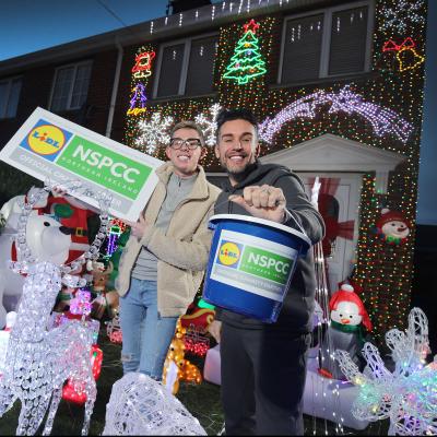 Two Men holding charity boxes